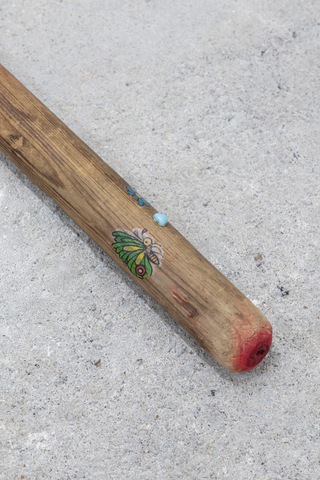 Multipass (for alignment), 2023. Rake, temporary tattoos, stickers, quartz, heart shaped bead, soft pastel,
8 x 20 x 123 cm (detail)