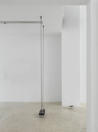 Swing (Die Gedanken sind frei solange man sie nicht erraten kann.*), 2020. Steel chains, steel ceiling mounting, PVC swing seat, 275 cm x 27 cm x 16 cm, in: Tell me I belong, 2021, MISC, Athens 
* Thoughts are free as long as one can’t guess them.